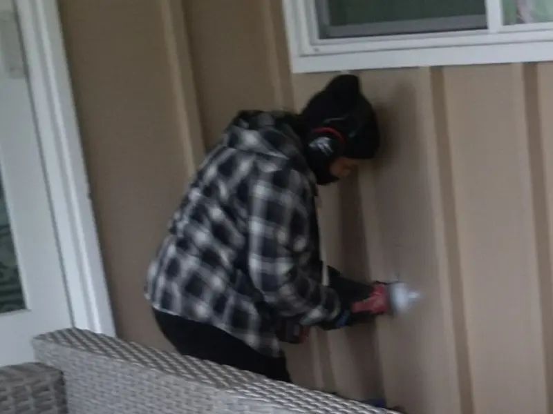 Professional electrician installing an exterior outlet in Dickson City