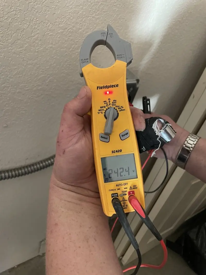 Voltage testing with clamp meter during Ceiling Fan Installation in Dickson City